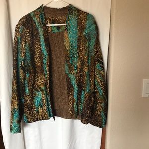 Two piece reversible jacket and shell. Blue and brown in color